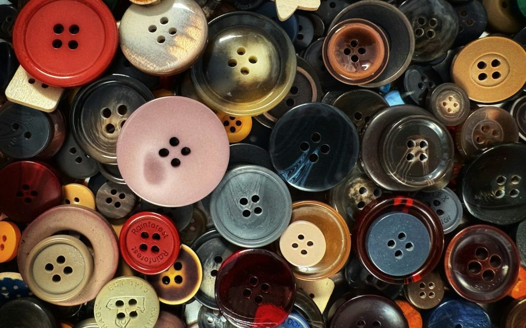 A collection of colorful buttons of various sizes.