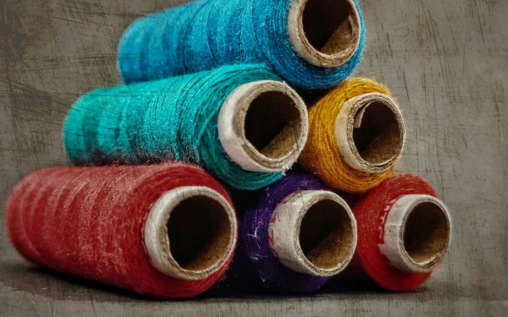 Blue red and yellow thread rolls