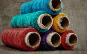 Blue red and yellow thread rolls