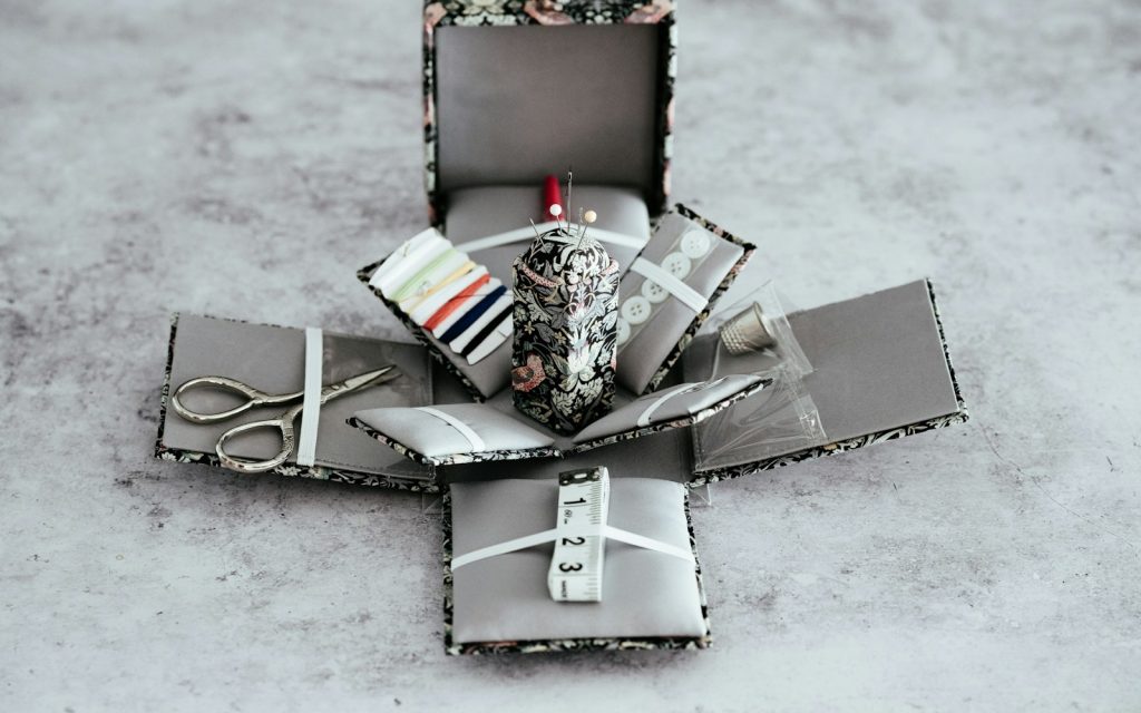 Scissors and knitting kits on box